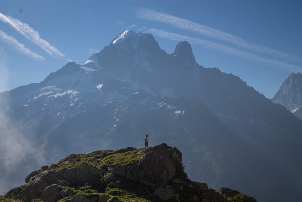 A lone figure looks insignificantly small against the French Alps